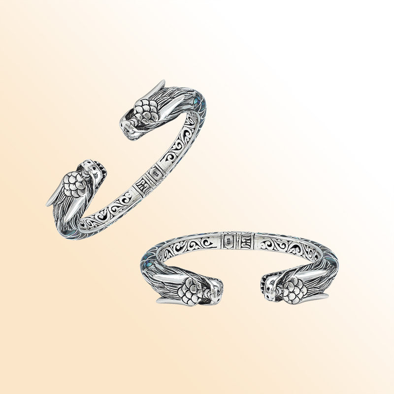 Handcrafted sterling silver phoenix bangle with Abalone Shell, featuring ornate Balinese engraving and a secure hinge lock for beauty, comfort, and everyday meaningful style.