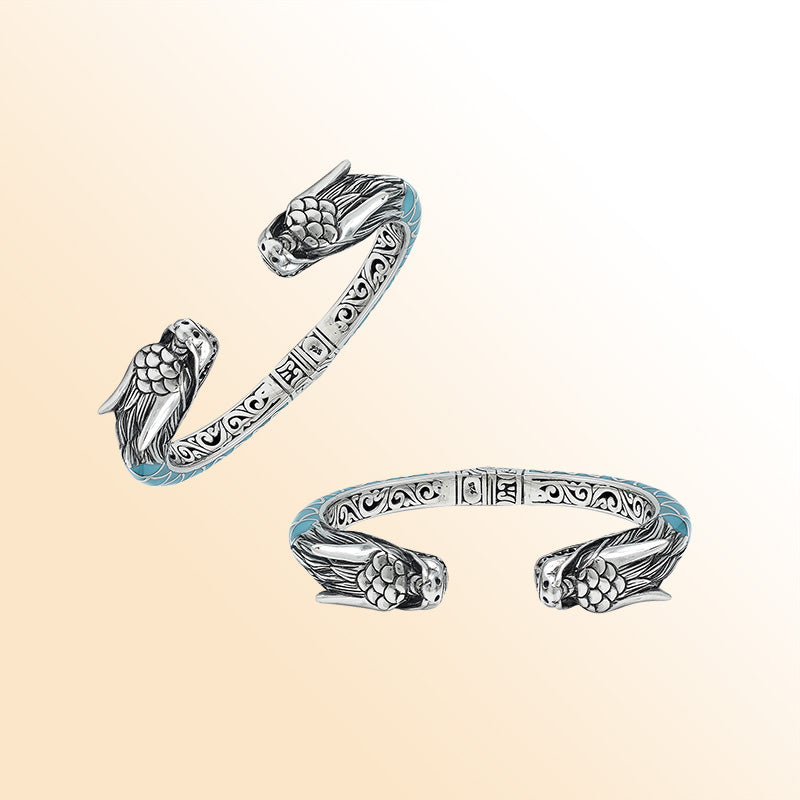 Handcrafted sterling silver phoenix guardian bangle featuring Turquoise Shell accents, rich Balinese scroll engravings, and a secure hinge lock for expressive, meaningful, and beautifully detailed wear.