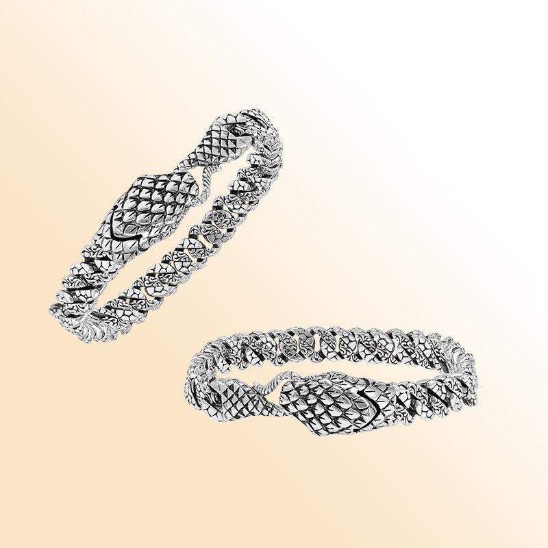 Handcrafted sterling silver dragon-scale bangle featuring a woven chain design, detailed Balinese artistry, and a secure hook lock for bold everyday styling.