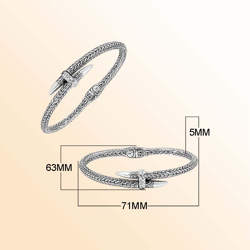 Handcrafted sterling silver woven chain bangle featuring a nail-head design, ornate Balinese scroll engravings, and a secure hinge lock for bold, artisan-inspired daily wear.