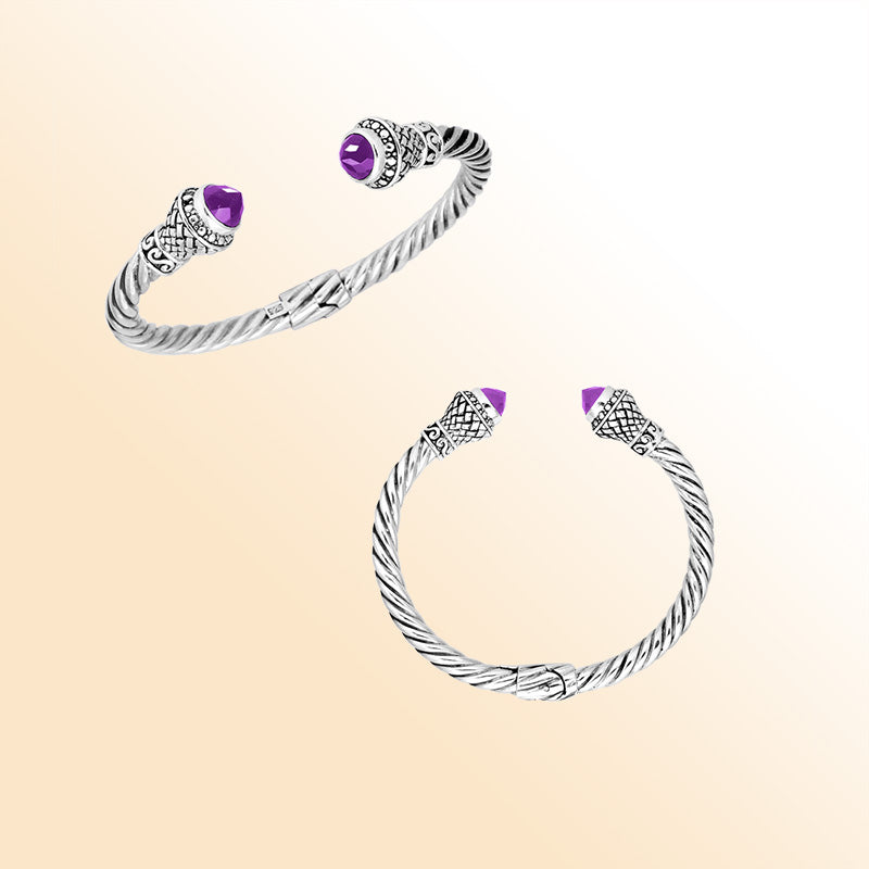 Handcrafted sterling silver cable cuff bracelet featuring faceted amethyst quartz end caps, 4MM band size, hinge lock, and ornate Balinese scrollwork.