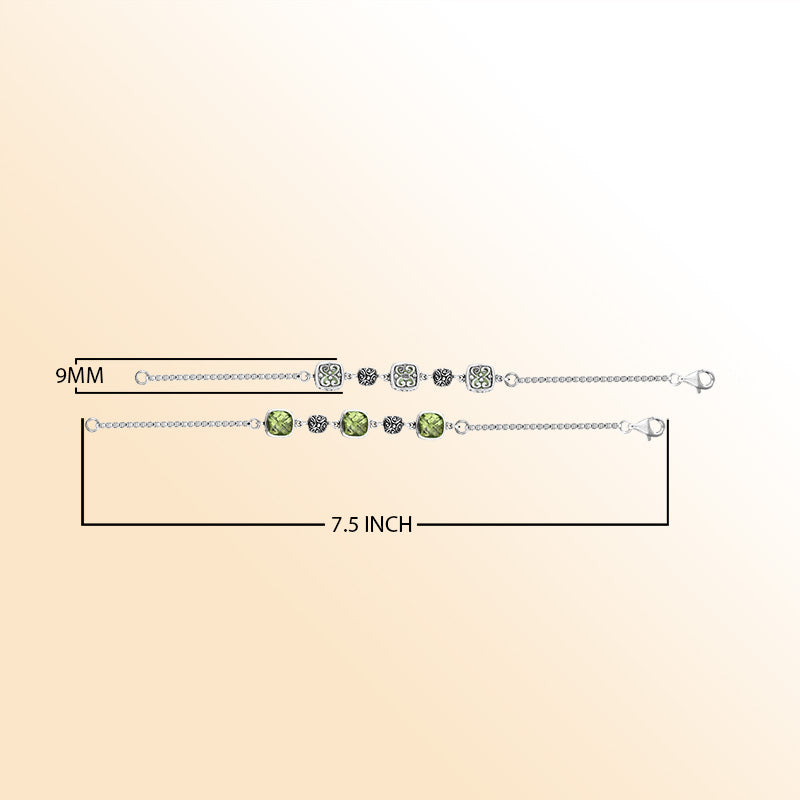 Sterling silver bracelet showcasing luminous green amethyst quartz stones paired with detailed Bali filigree motifs, crafted to add elegance and artisan charm to daily wear.