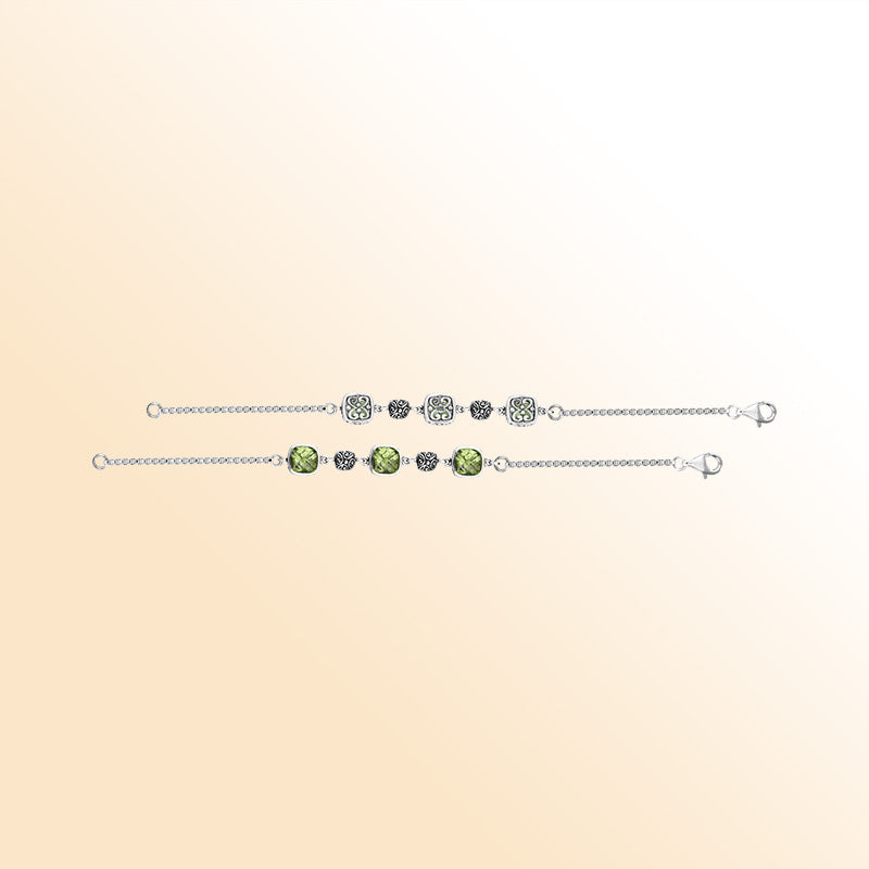 Sterling silver bracelet showcasing luminous green amethyst quartz stones paired with detailed Bali filigree motifs, crafted to add elegance and artisan charm to daily wear.