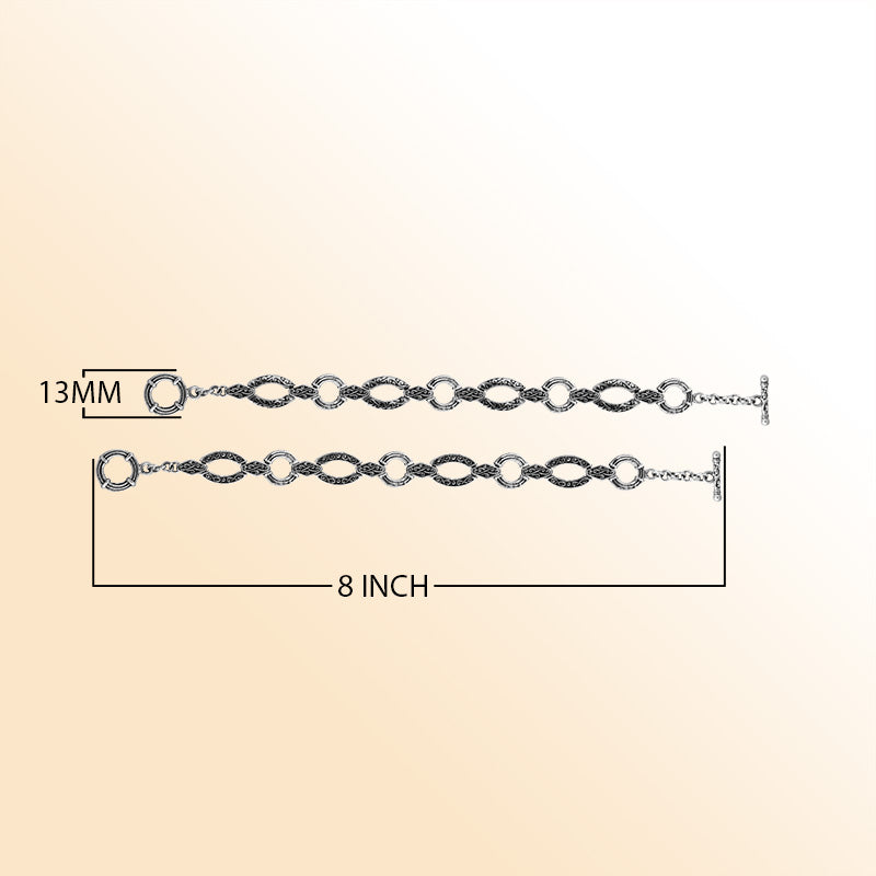 Sterling silver Bali infinity-link bracelet featuring engraved detailing and smooth connectors, finished with a toggle closure for elegant and comfortable daily wear.