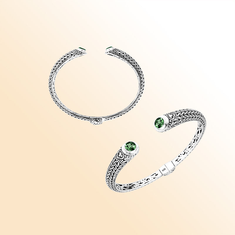 Sterling silver Bali engraved hinge cuff bracelet featuring bright green quartz stones with polished–oxidized detailing, created for individuals who appreciate expressive artisan-crafted jewelry.