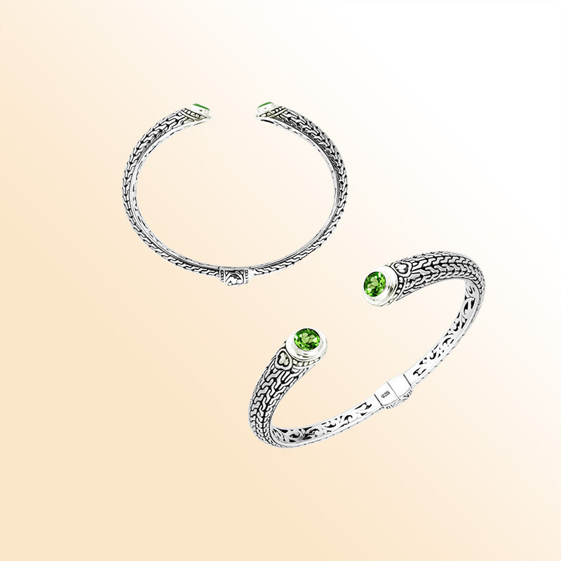 Sterling silver Bali engraved hinge cuff featuring radiant peridot quartz stones and polished–oxidized detailing, designed for individuals who appreciate expressive artisan-crafted jewelry with vibrant color.