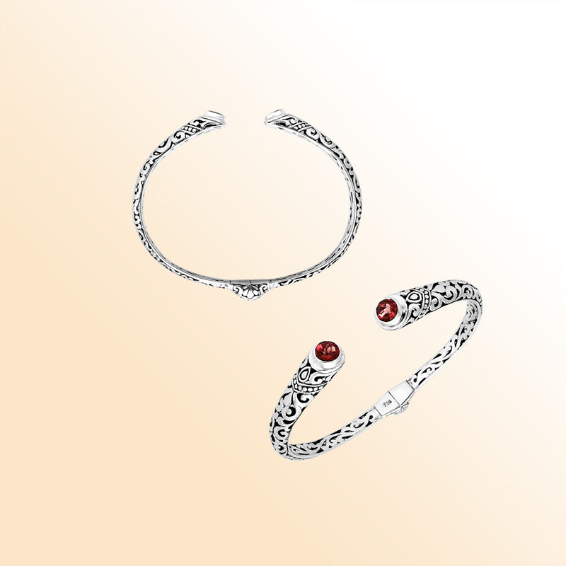 Sterling silver Bali engraved hinge cuff bracelet featuring glowing red garnet quartz stones with polished–oxidized detailing, created for individuals who appreciate expressive and artistic handcrafted jewelry.