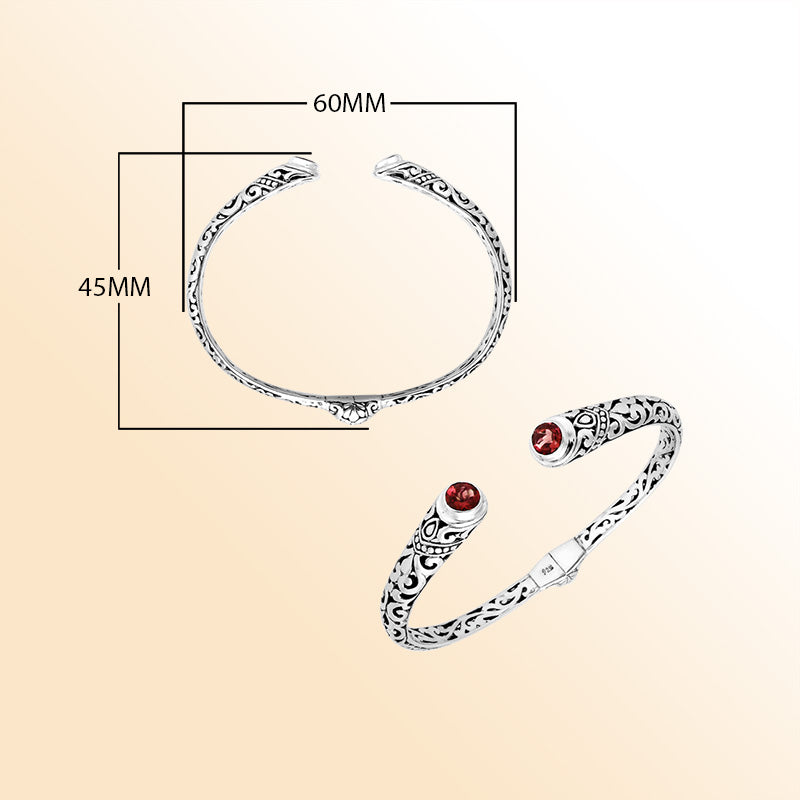 Sterling silver Bali engraved hinge cuff bracelet featuring glowing red garnet quartz stones with polished–oxidized detailing, created for individuals who appreciate expressive and artistic handcrafted jewelry.
