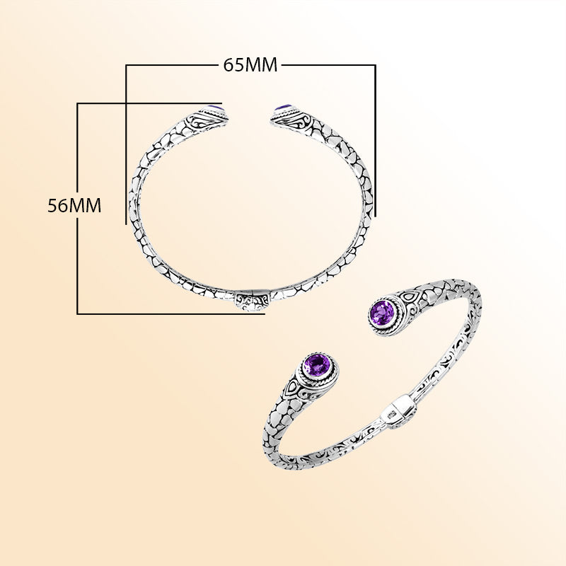 Sterling silver Bali hinge cuff featuring polished–oxidized engravings and radiant amethyst quartz ends, crafted for individuals who appreciate expressive, artistic, and beautifully detailed jewelry.