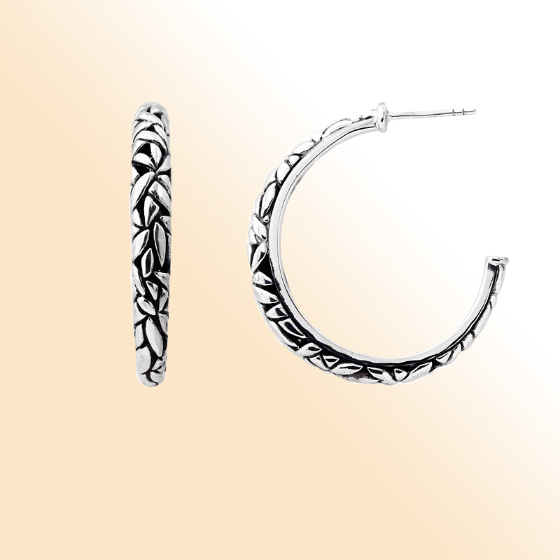 Handcrafted sterling silver hoop earrings with textured leaf design and oxidized finish, artisan Bali jewelry