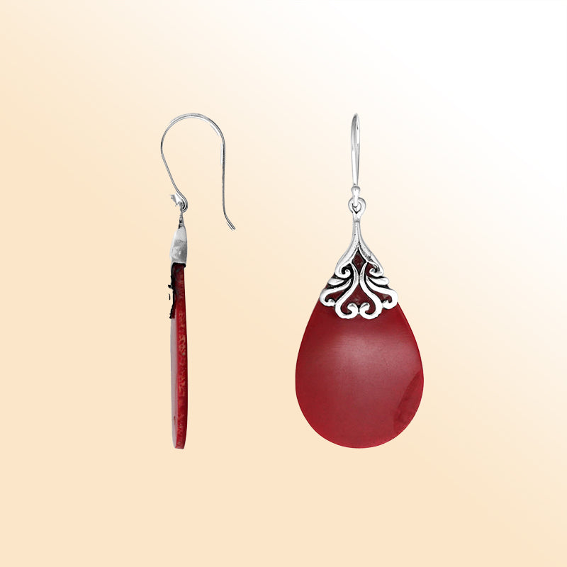 Sterling silver coral teardrop earrings with scroll accent for women