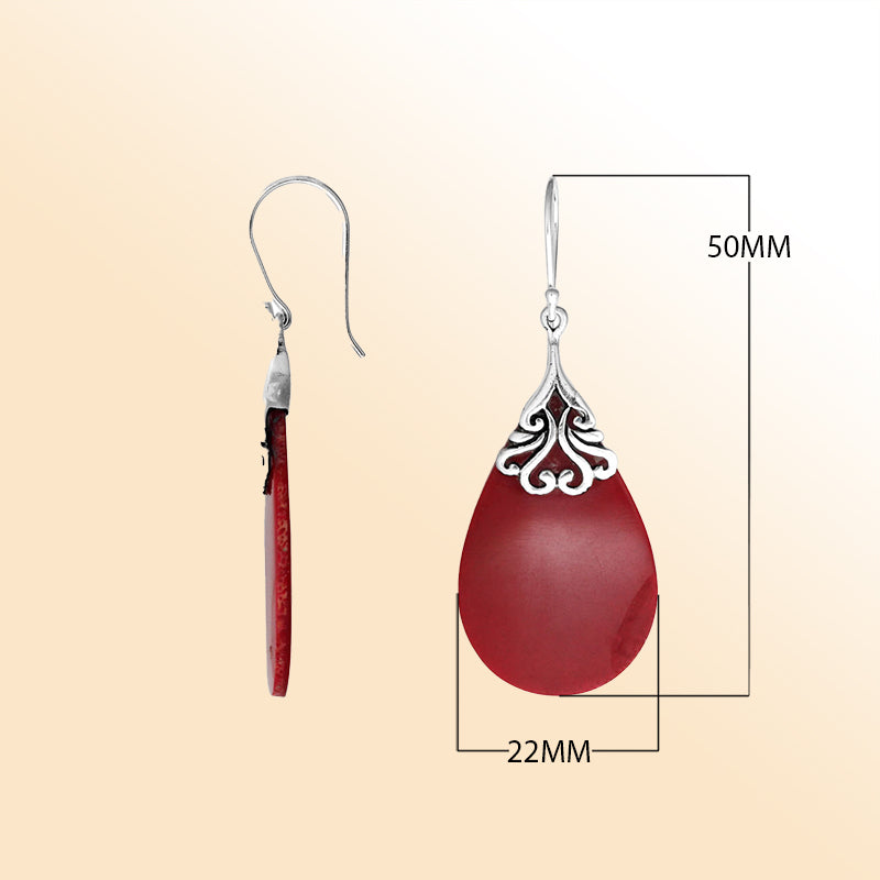 Sterling silver coral teardrop earrings with scroll accent for women