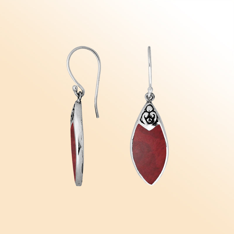 Handcrafted sterling silver marquise drop earrings with vibrant red coral inlay and Balinese scrollwork design