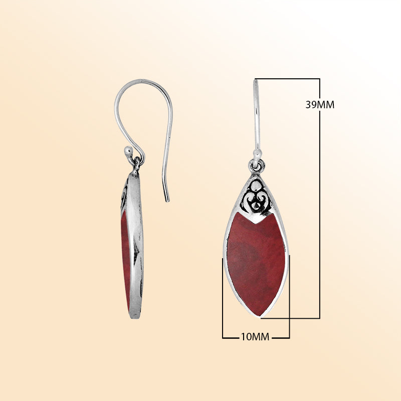 Handcrafted sterling silver marquise drop earrings with vibrant red coral inlay and Balinese scrollwork design