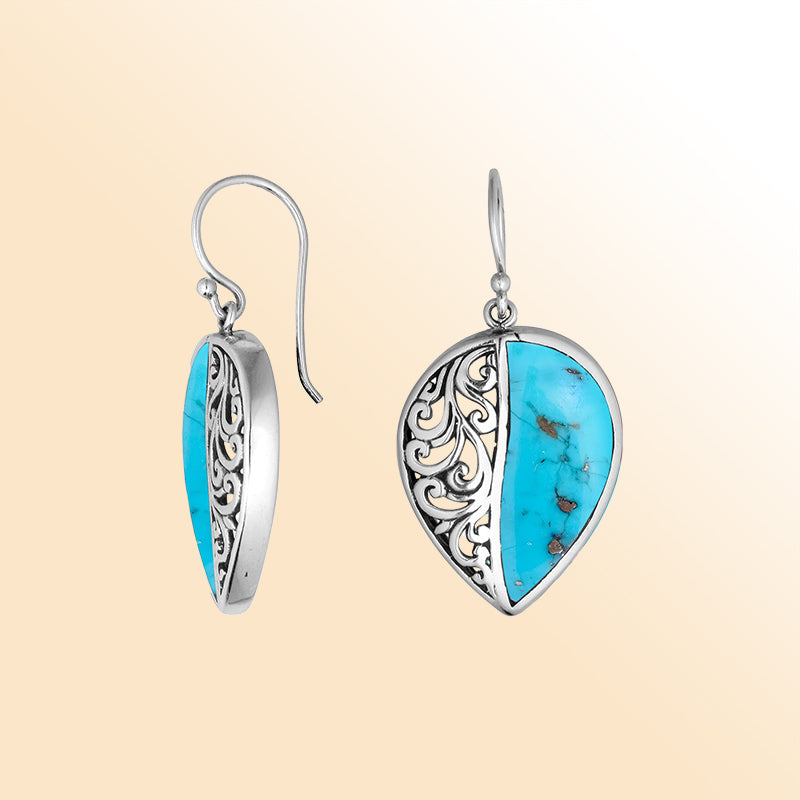 Teardrop silver earrings featuring Turquoise Shell and an ornate Bali scroll pattern.