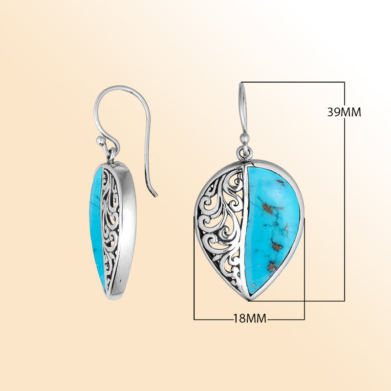 Teardrop silver earrings featuring Turquoise Shell and an ornate Bali scroll pattern.
