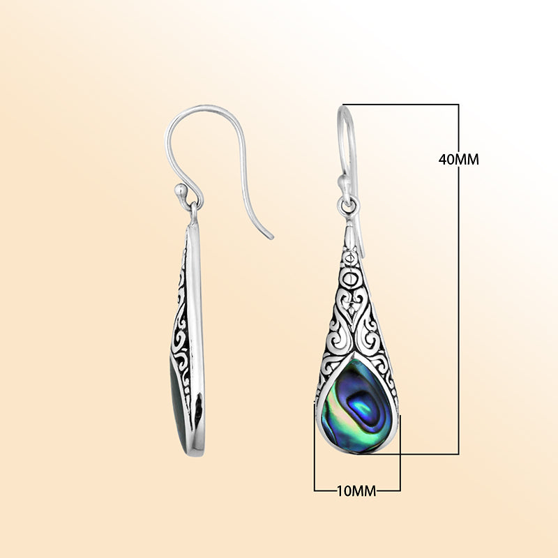 Silver teardrop earrings featuring Abalone Shell and ornate Bali scroll patterns.