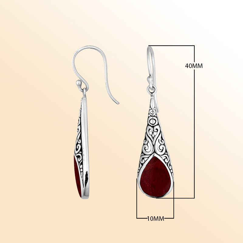 Silver teardrop earrings featuring Red Coral and ornate Bali scroll patterns.