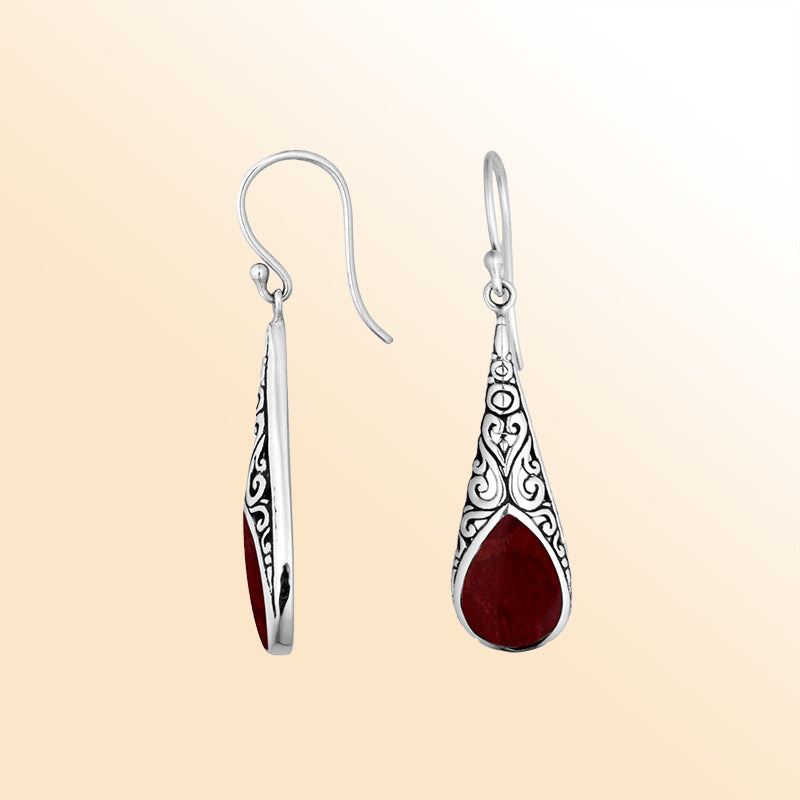Silver teardrop earrings featuring Red Coral and ornate Bali scroll patterns.