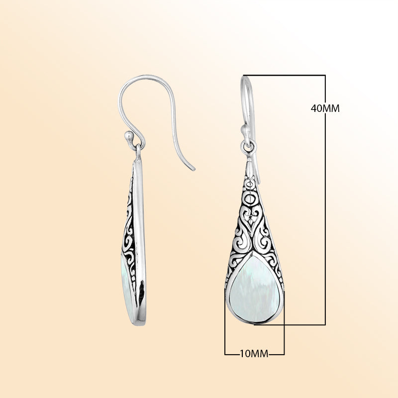 Silver teardrop earrings featuring Mother of Pearl and ornate Bali scroll patterns.
