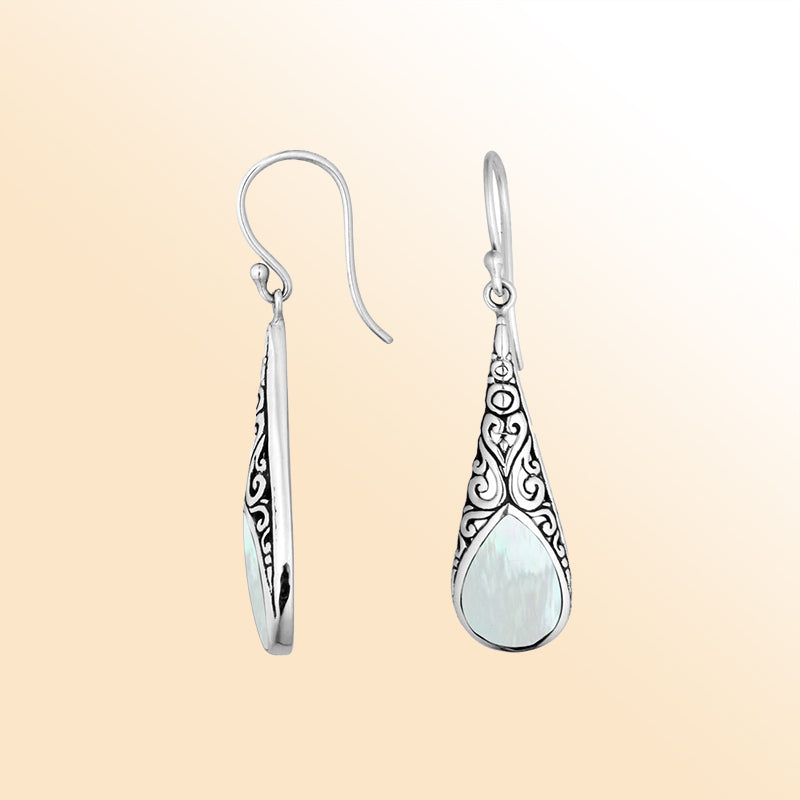 Silver teardrop earrings featuring Mother of Pearl and ornate Bali scroll patterns.