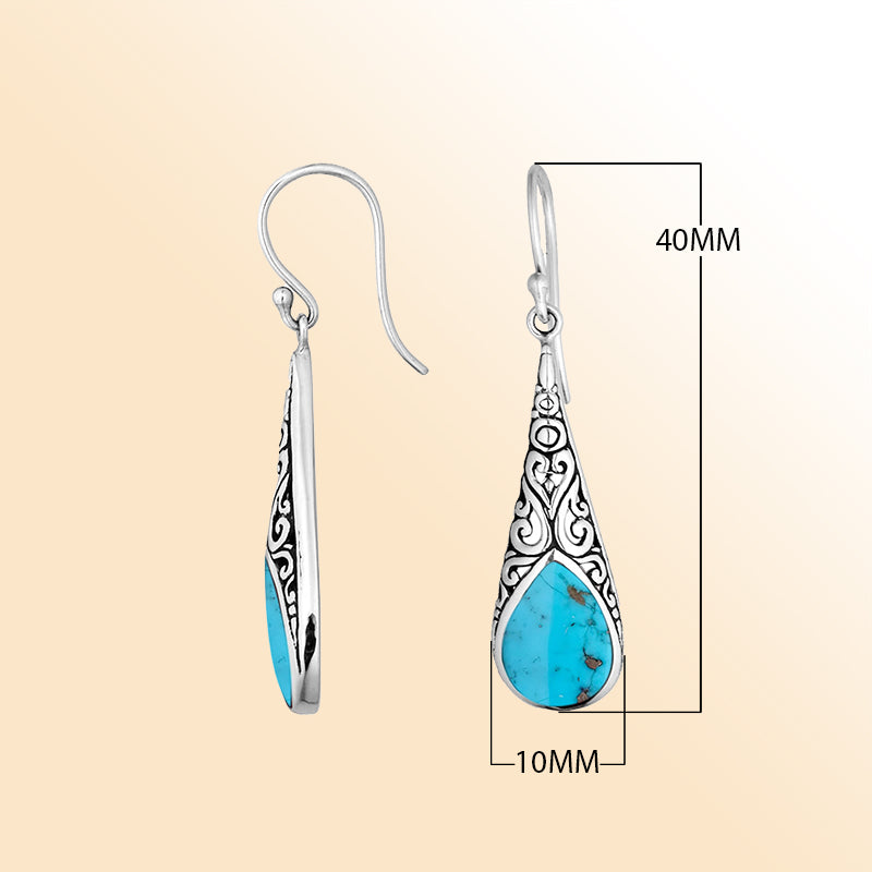 Silver teardrop earrings featuring Turquoise Shell and ornate Bali scroll patterns.