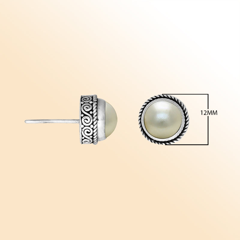 Silver stud earrings featuring natural White Pearls with ornate Bali scrollwork.