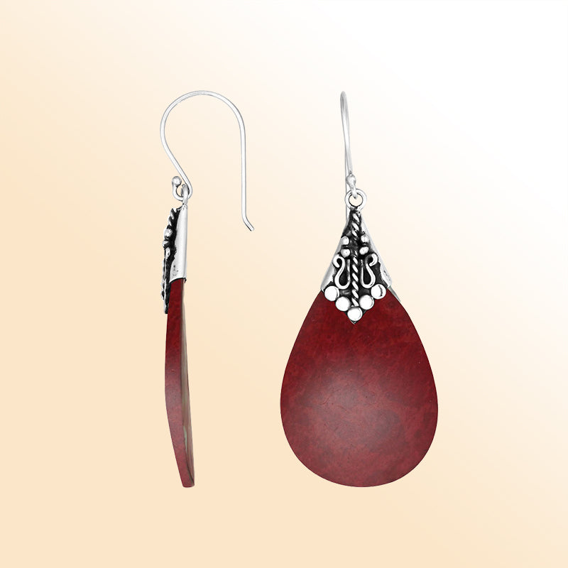 Elegant Red Coral teardrop earrings with ornate silver detailing and earwire lock
