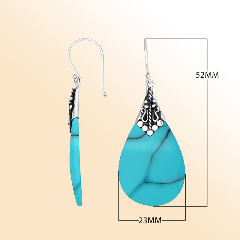 Elegant Turquoise Shell teardrop earrings with ornate silver detailing and earwire lock