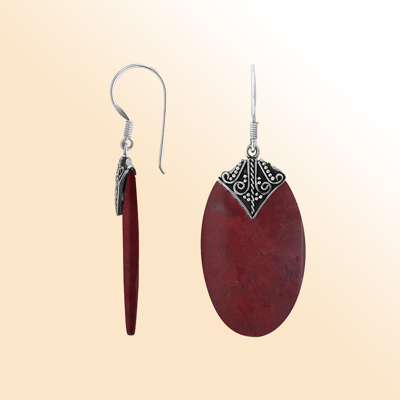 Elegant Red Coral oval earrings with ornate scroll silver detailing and earwire lock