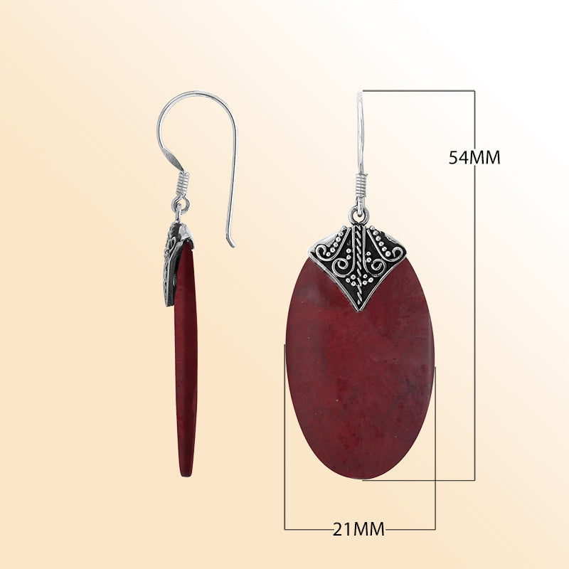 Elegant Red Coral oval earrings with ornate scroll silver detailing and earwire lock