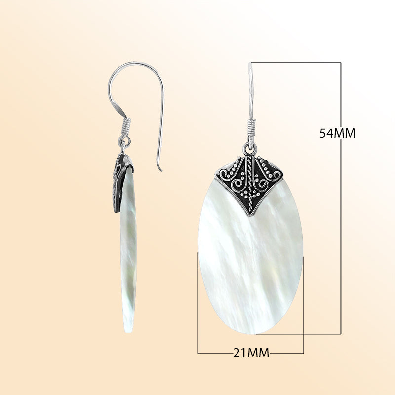 Elegant Mother Of Pearl oval earrings with ornate scroll silver detailing and earwire lock
