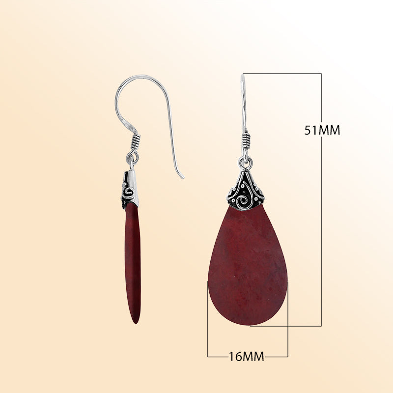 Elegant Red Coral teardrop earrings with ornate swirl silver detailing and earwire lock