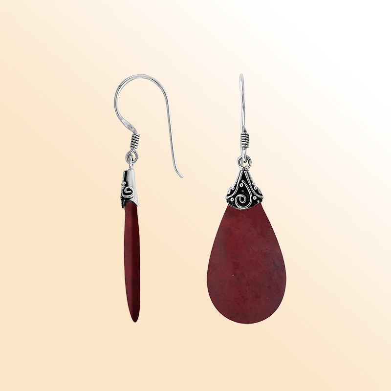 Elegant Red Coral teardrop earrings with ornate swirl silver detailing and earwire lock