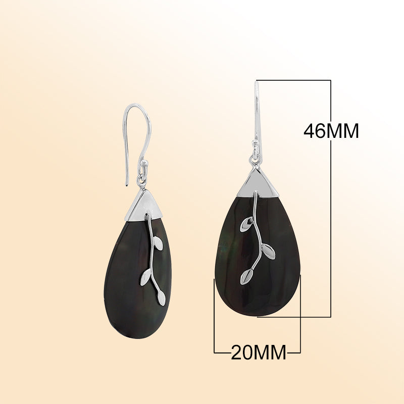 Artistic silver teardrop earrings with black shell