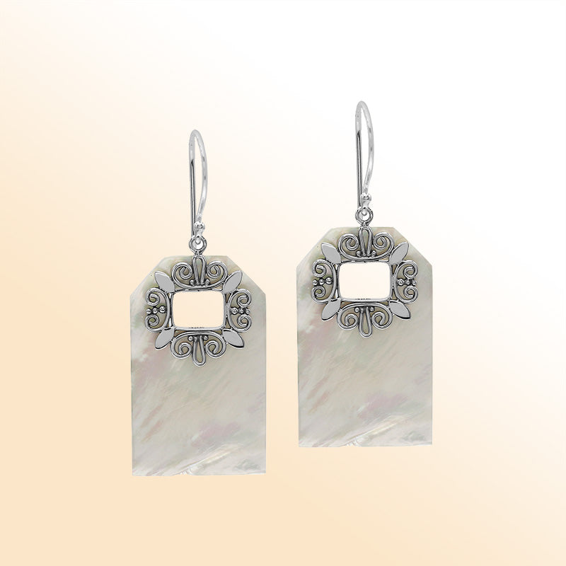 Artistic Mother of Pearl earrings with ornate silver filigree