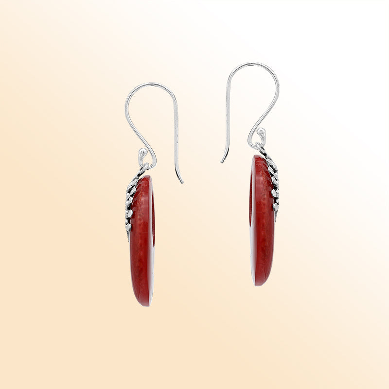 Elegant sterling Silver Red Coral earrings with open circle styling and polished sunburst silver accents.