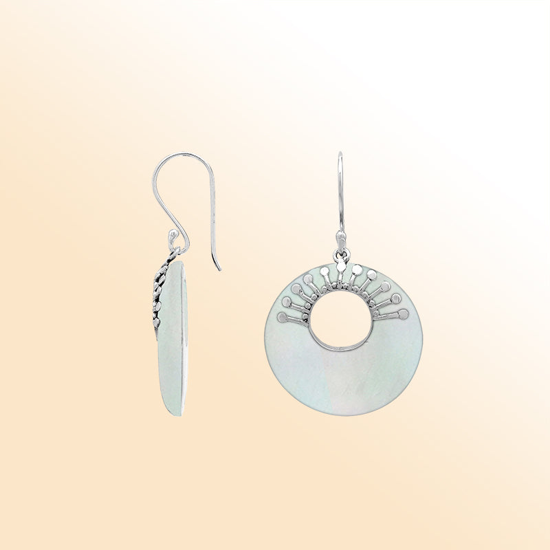 Elegant sterling silver Mother Of Pearl drop earrings with cascading round shapes and luminous iridescent detailing.