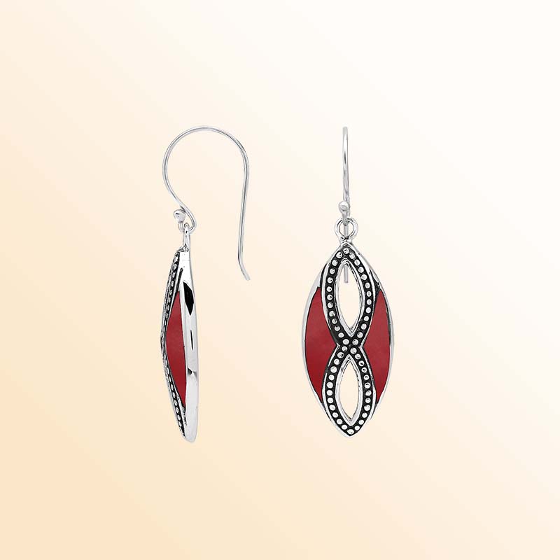 Elegant Sterling Silver Red Coral drop earrings showcasing rich crimson inlays, intricate infinity-shaped silver openwork, delicate oxidized bead accents, polished marquise frames, and graceful fishhook ear wires.