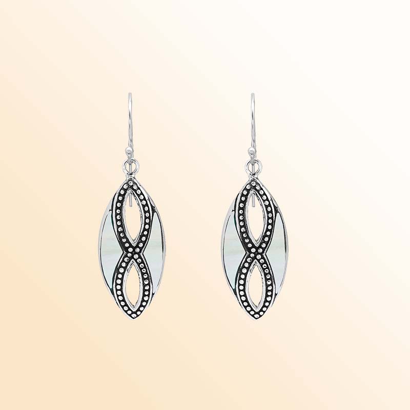Elegant Sterling Silver Mother Of Pearl drop earrings displaying softly shimmering white shell inlays, intricate infinity-shaped silver openwork, oxidized beaded accents, polished marquise frames, and graceful fishhook ear wires.