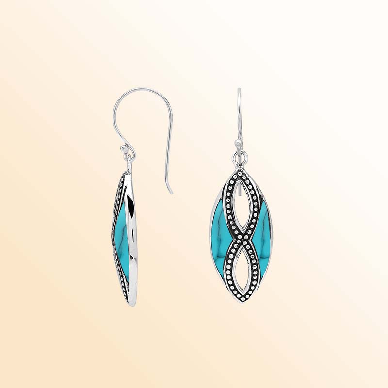 Elegant Sterling Silver Turquoise Shell drop earrings showcasing vivid tropical blue inlays, intricate infinity-shaped silver openwork, delicate oxidized beaded accents, polished marquise frames, and graceful fishhook ear wires.