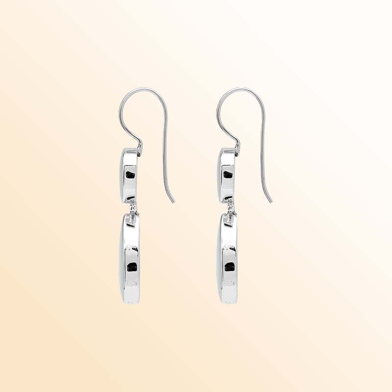 Elegant sterling silver Mother Of Pearl earrings featuring luminous round and teardrop drops, polished silver bezel frames, graceful articulation, and elongated ear wires.