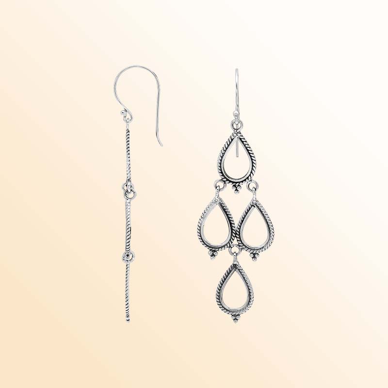 Artistic sterling silver chandelier earrings with cascading open teardrop frames, twisted rope detailing, delicate bead accents, elongated ear wires, and graceful articulated movement.