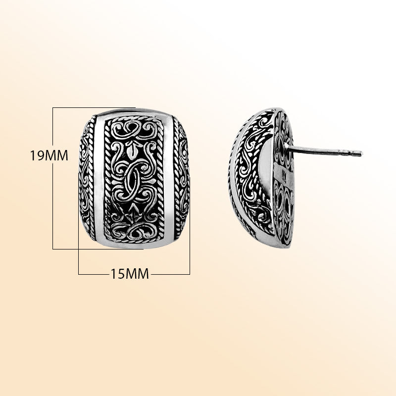 Elegant sterling silver stud earrings with intricate filigree scroll detailing and oxidized vintage finish.