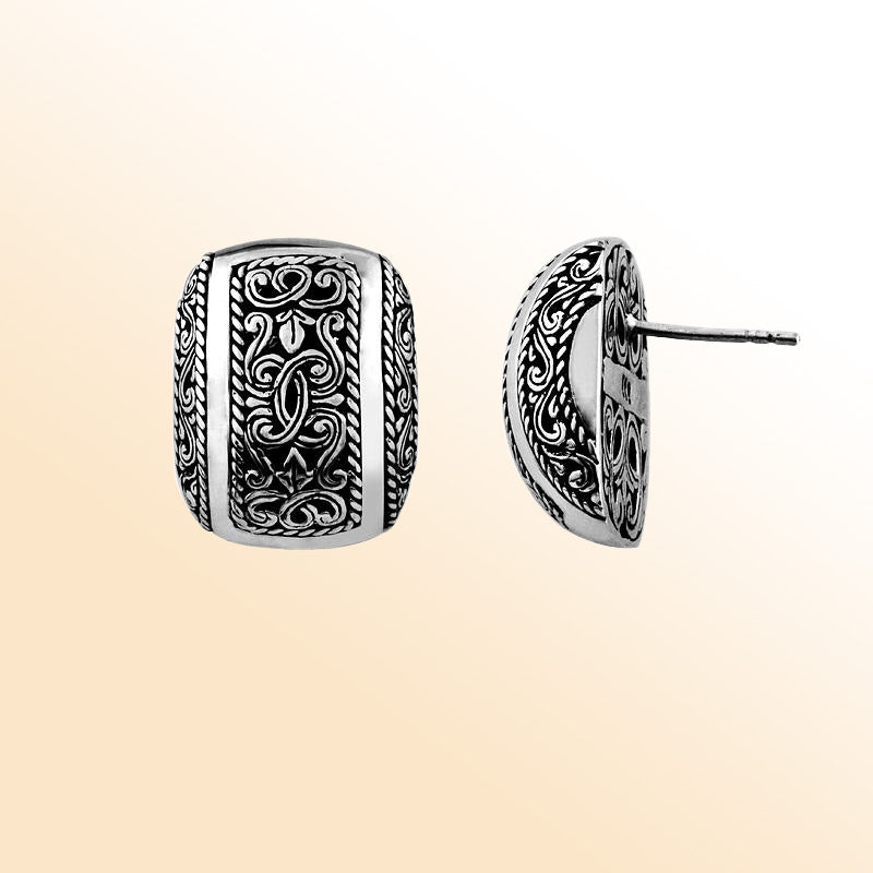 Elegant sterling silver stud earrings with intricate filigree scroll detailing and oxidized vintage finish.