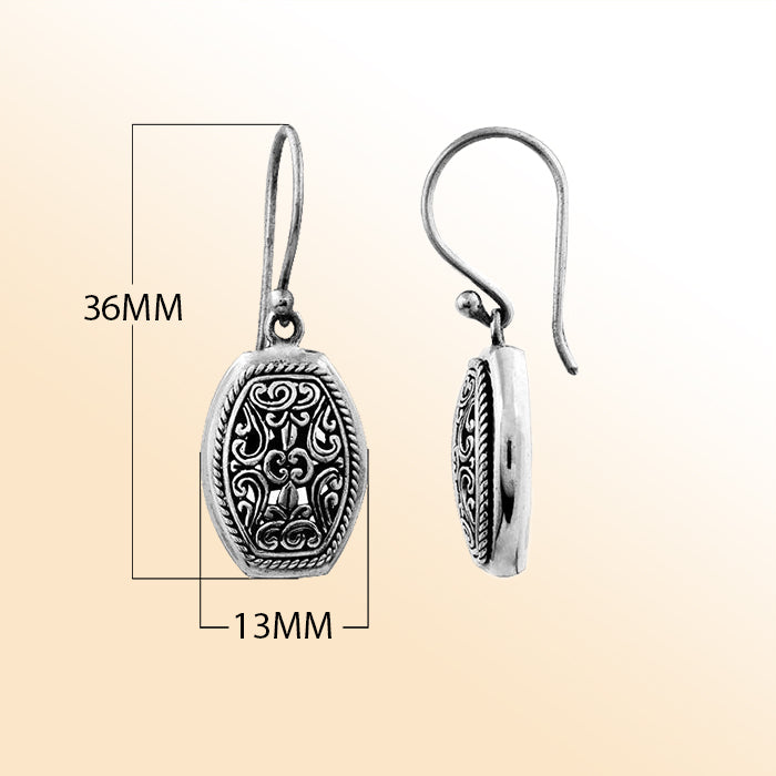 Elegant sterling silver hexagon earrings with intricate filigree scroll detailing and oxidized artisan finish.
