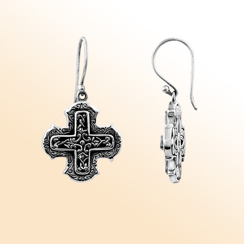 Elegant sterling silver cross earrings with ornate filigree scrollwork and oxidized artisan finish.