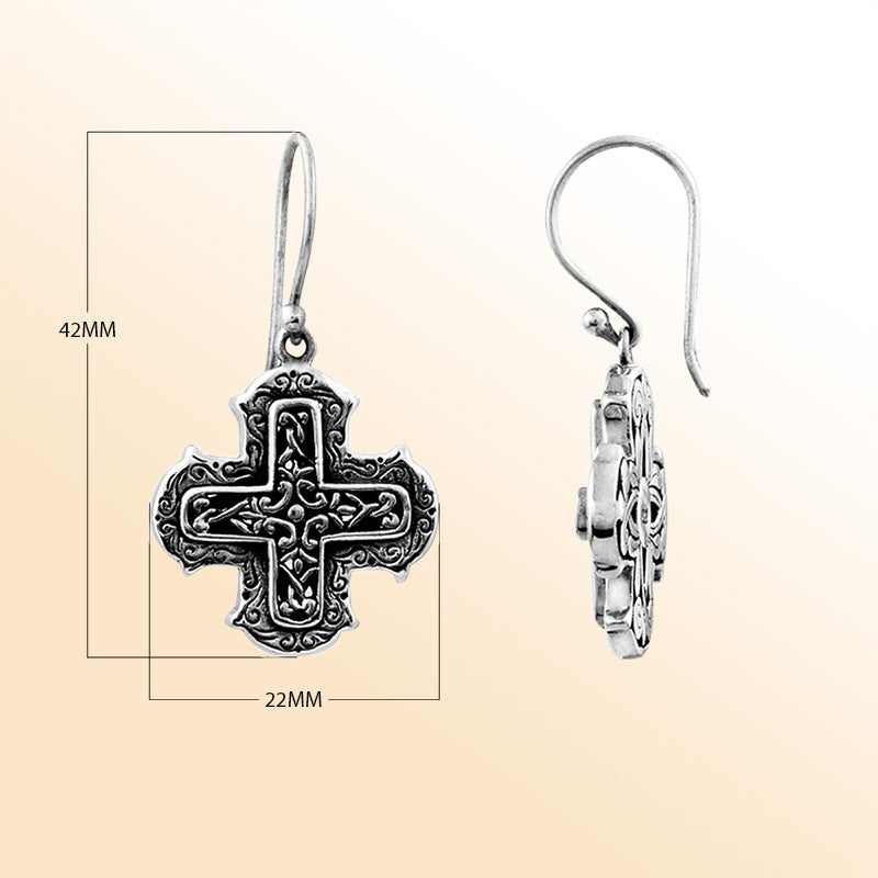 Elegant sterling silver cross earrings with ornate filigree scrollwork and oxidized artisan finish.