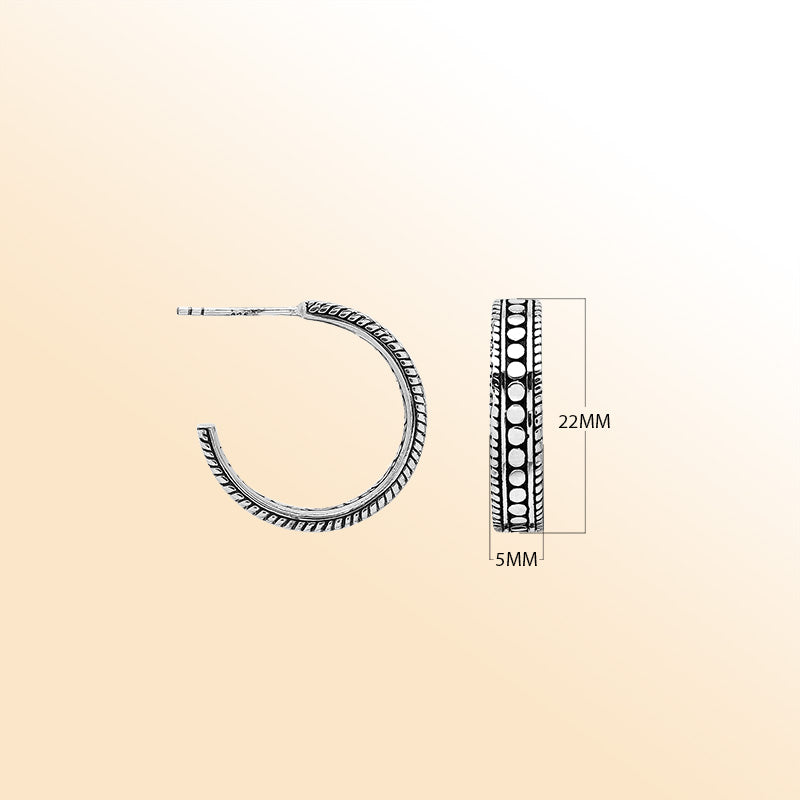 Artistic silver hoop earrings with dotted center and rope edges