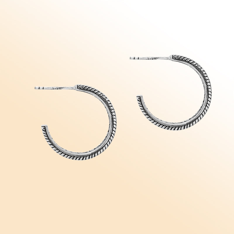 Artistic silver hoop earrings with dotted center and rope edges